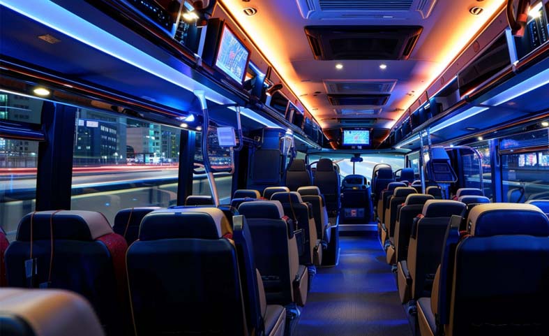 Interior of a spacious hired bus in Auckland, featuring comfortable seating and modern amenities